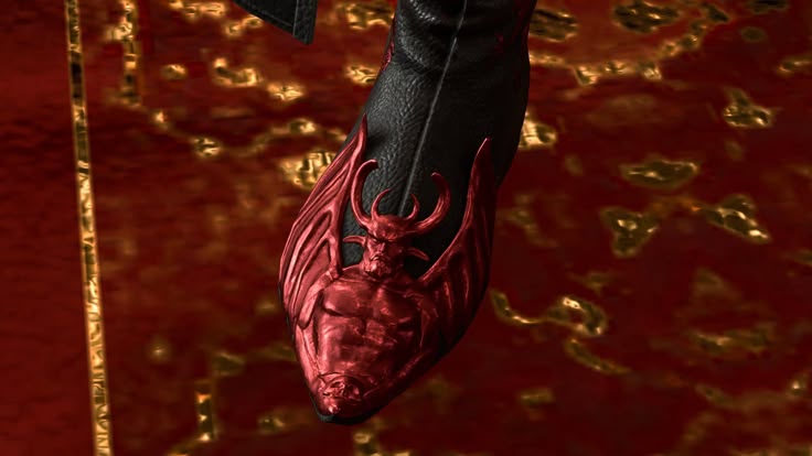 Red devil toe-cap on a black leather boot.
