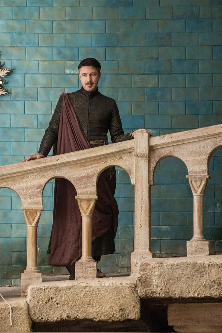 Petyr Baelish, smiling like he has already sold the floor.